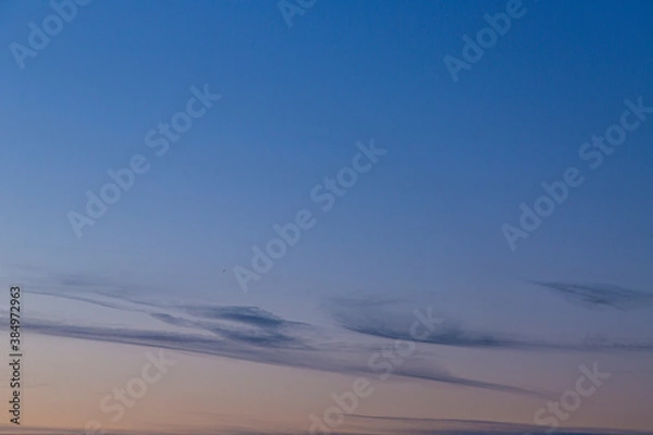 Fototapeta Dramatic colorful sky with afterglow and illuminated clouds