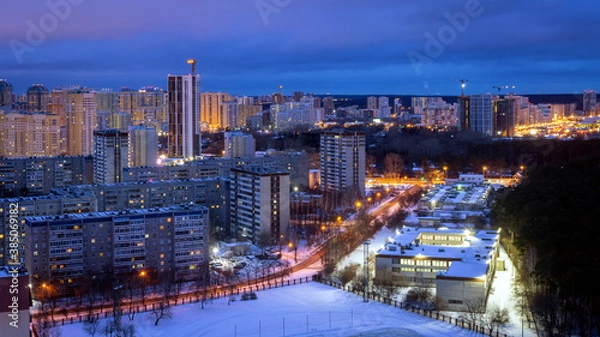 Fototapeta Night houses with a gleam of sunset in the city center 2