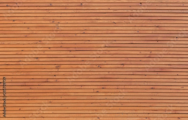 Fototapeta New and clean wall made of spruce tree's wood boards, viewed from the front. High resolution full frame textured background.