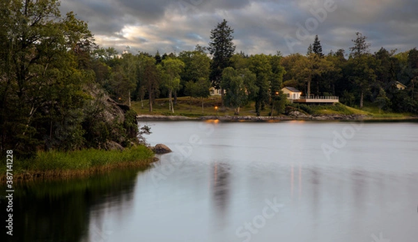 Obraz Lake in sunset light under cloudy sky