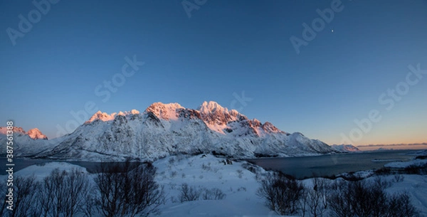 Fototapeta Winter landscape on the Lofoten. Mountain range in Norway. Travel during the winter. 