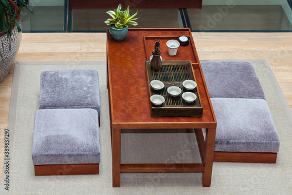 Fototapeta Modern Chinese tradition tea room.Potted plant and tea set on the table.