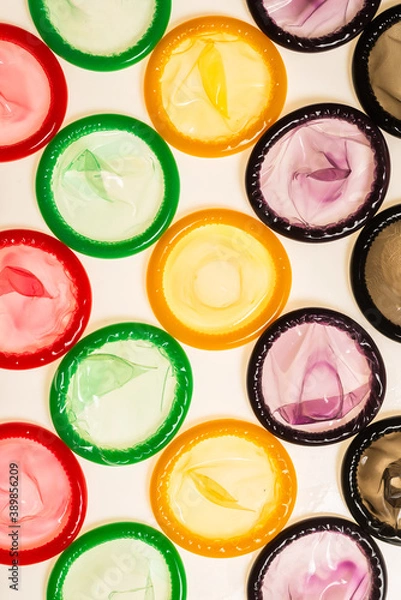 Fototapeta Colorful condoms background.