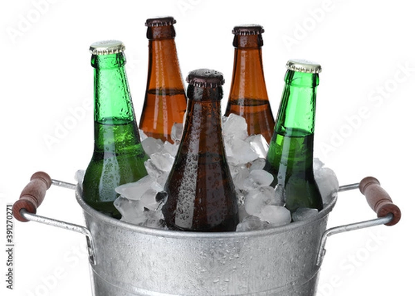 Fototapeta Metal bucket with bottles of beer and ice cubes isolated on white