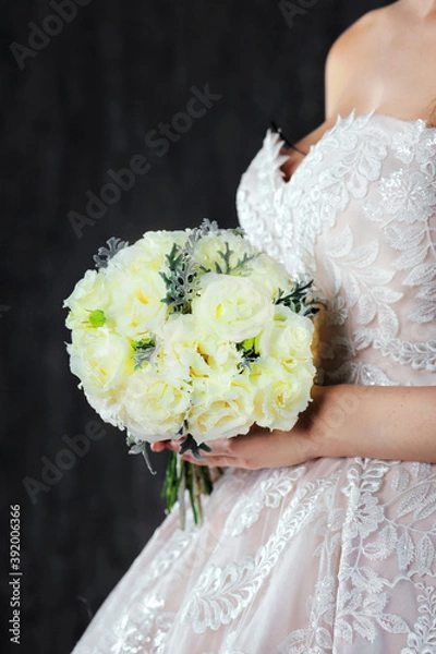 Fototapeta Bride with flowers in hands