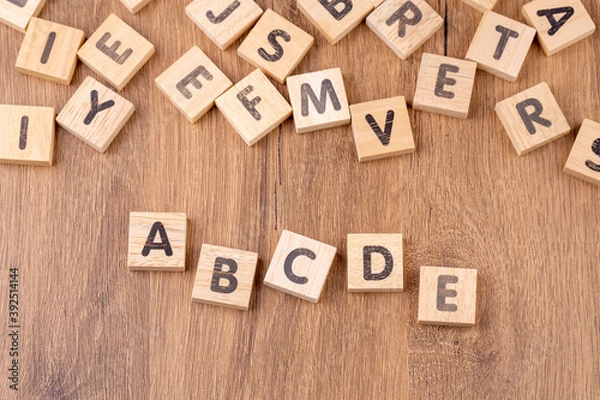 Fototapeta Alphabets on wooden cubes as a background