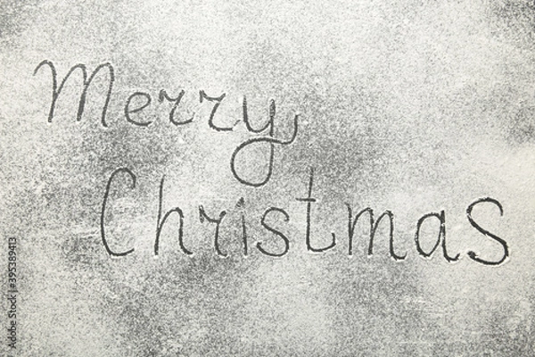 Obraz Christmas composition. Merry christmas text made with flour on black background.