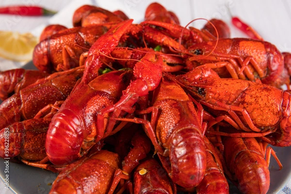 Fototapeta closeup gourmet  lobster on white wooden table