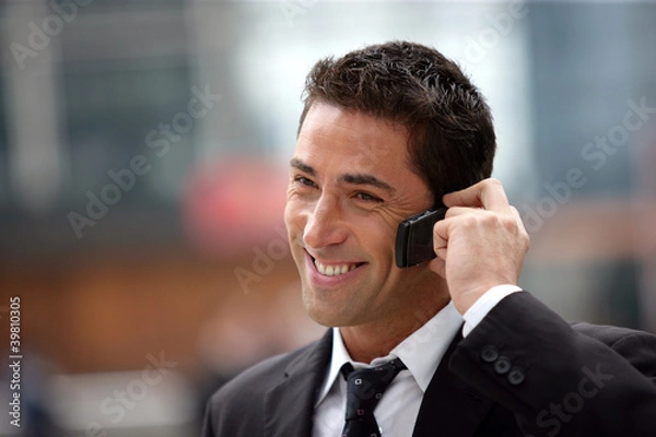 Fototapeta handsome businessman having phone call