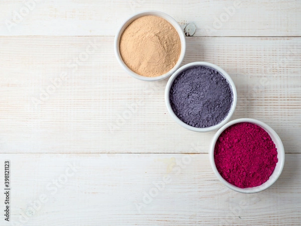 Fototapeta Set of superfoods in white bowls on wooden background.