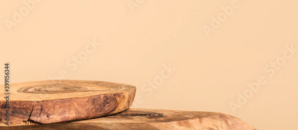 Fototapeta Background for cosmetic products of natural beige color. Rustic wood pieces podium. Front view.