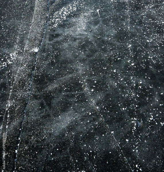 Fototapeta background of the surface of patterned black ice of a frozen lake