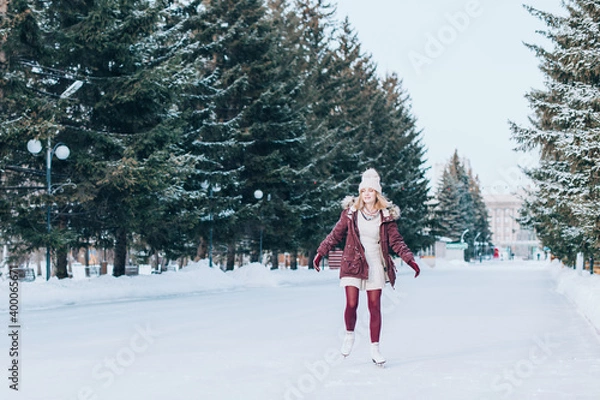 Fototapeta Beautiful girl having fun in winter park