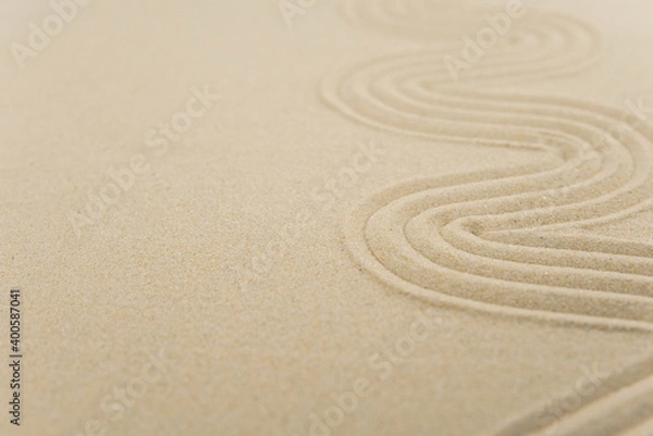 Fototapeta Zen sand garden meditation stone background with copy space. Stones and lines drawing in sand for relaxation. Concept of harmony, balance and meditation, spa, massage, relax. Set Sail Champagne color