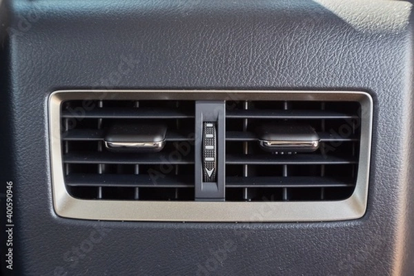 Fototapeta Car air vents providing airflow for backseat passengers