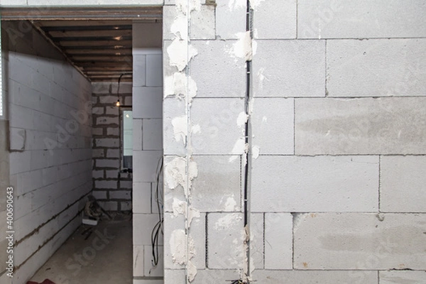 Fototapeta Brick wall in the room and a doorway