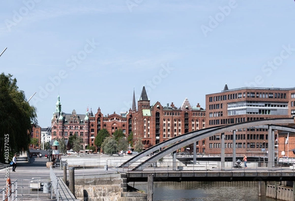 Fototapeta The historic Speicherstadt in Hamburg made out of Brick buildings with blue sky.