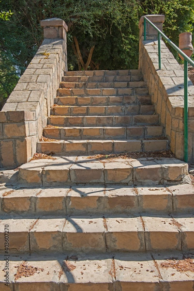 Fototapeta Closeup of stone steps on footpath