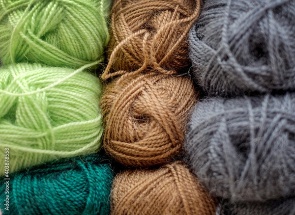 Fototapeta Set of colorful wool balls for knitting. Close-up photo background.