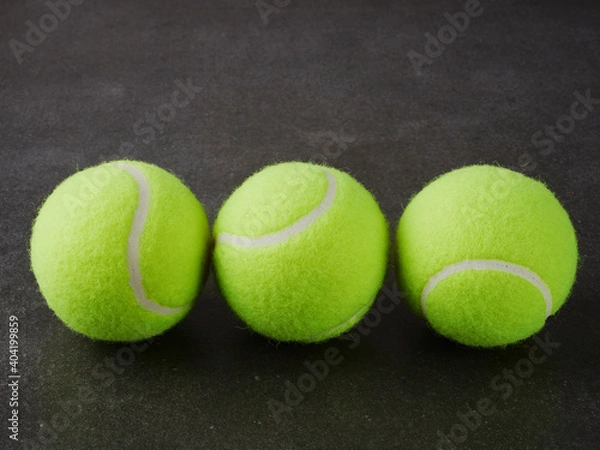 Fototapeta Sport and healthy lifestyle. Tennis. Yellow ball for tennis and a racket on table. Sports background with tennis concept.