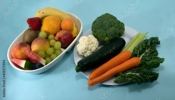 Fototapeta Fruit and Vegetables isolated on blue.