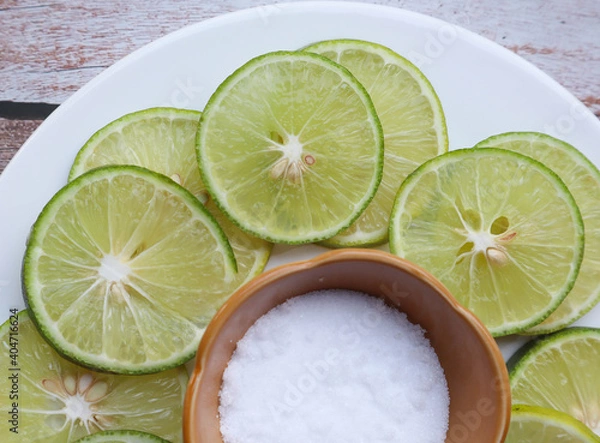 Fototapeta Lime sliced and salt - close up view 