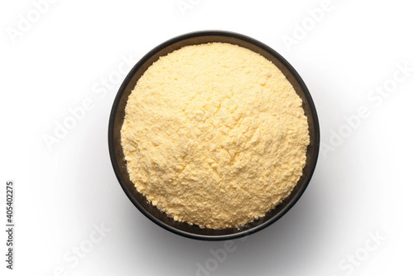 Fototapeta Corn flour in a black bowl isolated on white background. Top view.