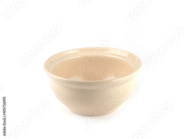 Fototapeta Beige ceramic bowl isolated on a white background. Use for home or restaurant, food design. Kitchen accessory..