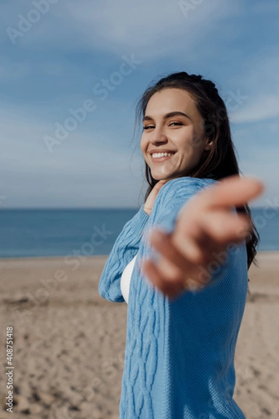 Fototapeta Happy young smiling woman outdoors. freedom and calm concept