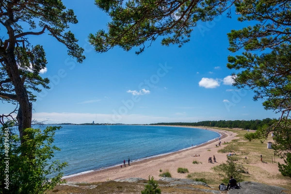 Fototapeta Sunny sand beach at seaside of Hanko town in southmost part of Finland