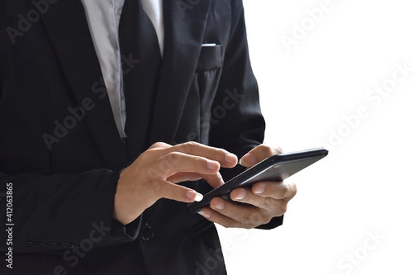 Obraz Close up of man using mobile smartphone isolated on white background. with clipping path.