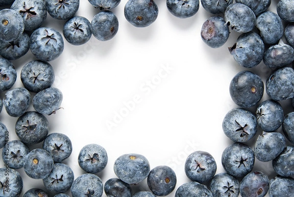 Fototapeta Blueberries in the vignette a white background