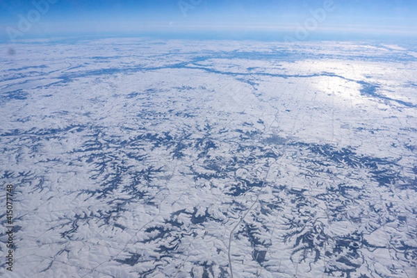 Fototapeta Snowy plains with mountain ridges