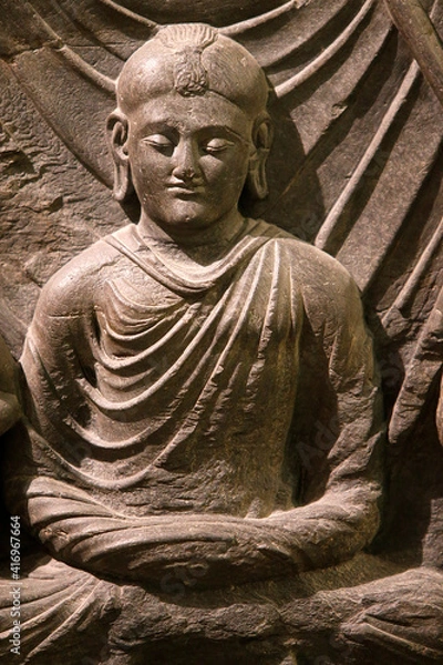 Fototapeta The Victoria and Albert Museum. Part of a relief of the Buddha's death (parinirvana). 200-400. Kushan period. Schist. Gandhara. Northwest Pakistan. United kingdom. 25.02.2017