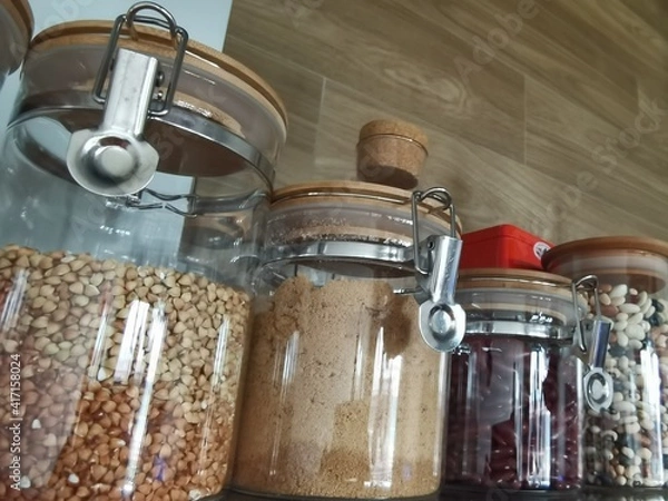 Fototapeta Glass jars with a cereals and legumes