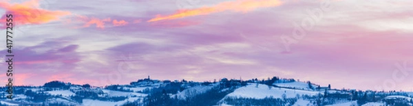 Fototapeta Italy Piedmont: panoramic view wine yards unique landscape, moody sky at sunset, the Alps in the background, italian heritage