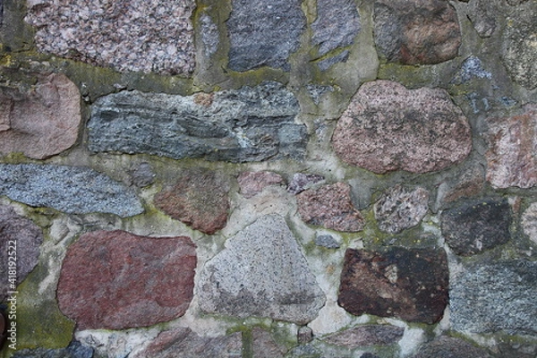 Fototapeta Old weathered natural stone wall background texture, ancient stonework laying