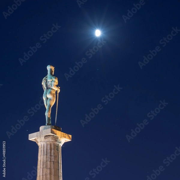 Fototapeta Victor monument illuminated by the moonlight in Belgrade, Serbia