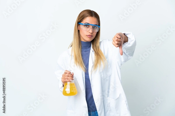 Fototapeta Young scientific woman isolated on white background showing thumb down with negative expression