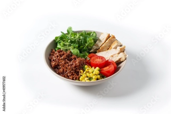 Fototapeta Bowl Turkey fillet, brown rice, corn, tomato and corn salad