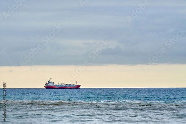 Fototapeta ship on the ocean horizon