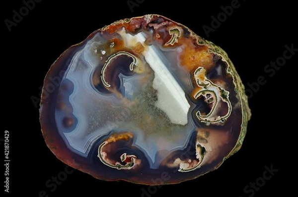 Fototapeta A cross-section of agate.  Horizontal agate with quartz-agate fill. Origin: Rudno near Krakow, Poland.