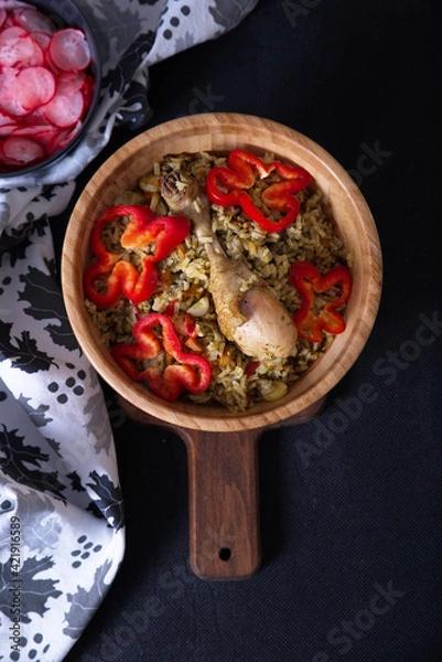 Fototapeta Typical dish of Peru Rice with chicken, in dark food tones and as a complement beet salad.