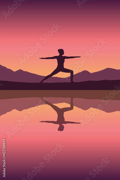 Fototapeta girl makes yoga by the lake at sunset