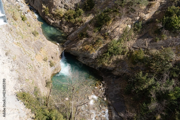 Fototapeta turquoise blue river between two mountains, rocky gorge. Spain Huesca