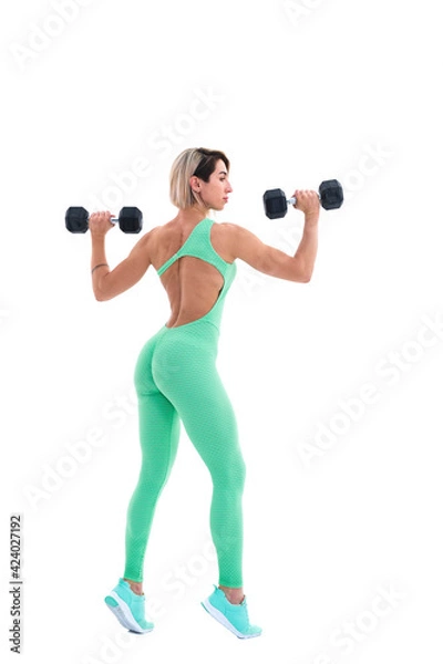 Fototapeta Strong woman with dumbbells. Photo of sporty woman in sportswear on white background. Back view