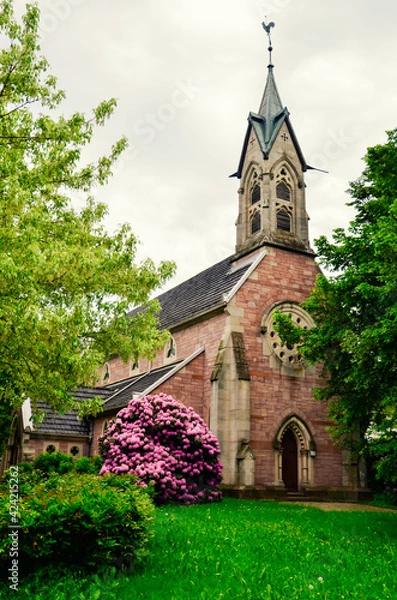 Fototapeta Small Gothic Christian Catholic chapel in a green garden