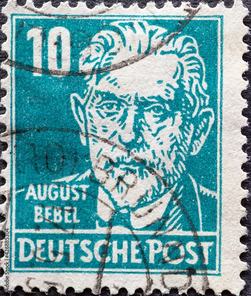 Fototapeta GERMANY - CIRCA 1948: a postage stamp from Germany, showing a portrait of the politician and worker leader August Bebel