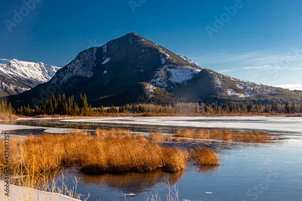 Fototapeta Sulphur Mountain and a partially frozen Vermillion Lakes. Banff National Park, Alberta, Canada