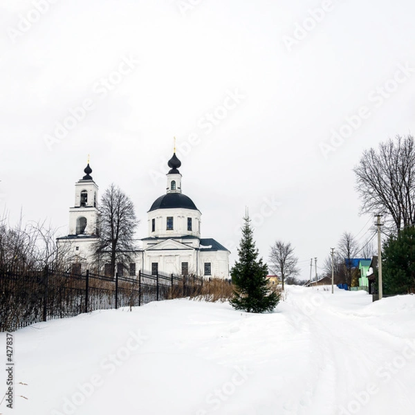 Fototapeta landscape with a rural orthodox church in winter